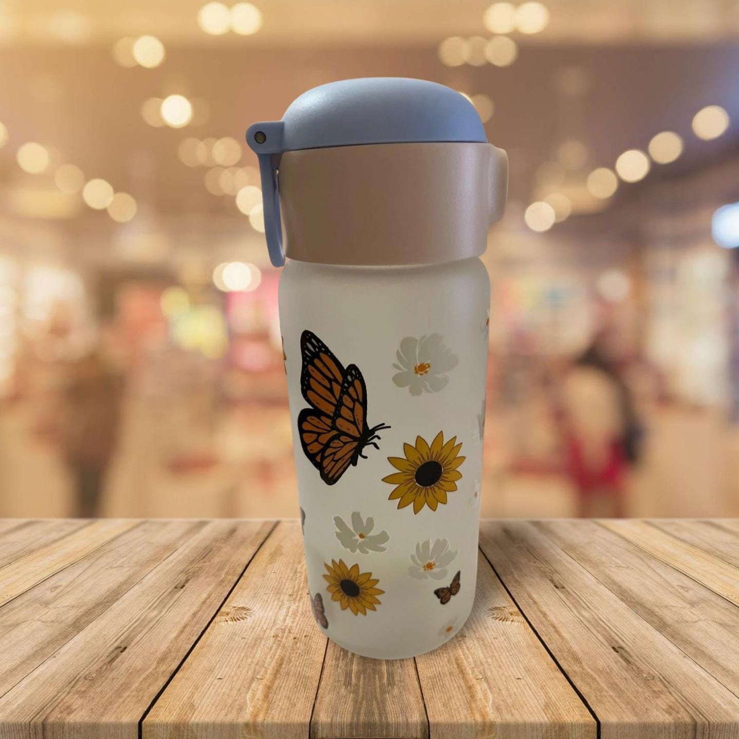 15 oz Frosted Glass Water Bottle with Blue Lid- Flowers and butterflies