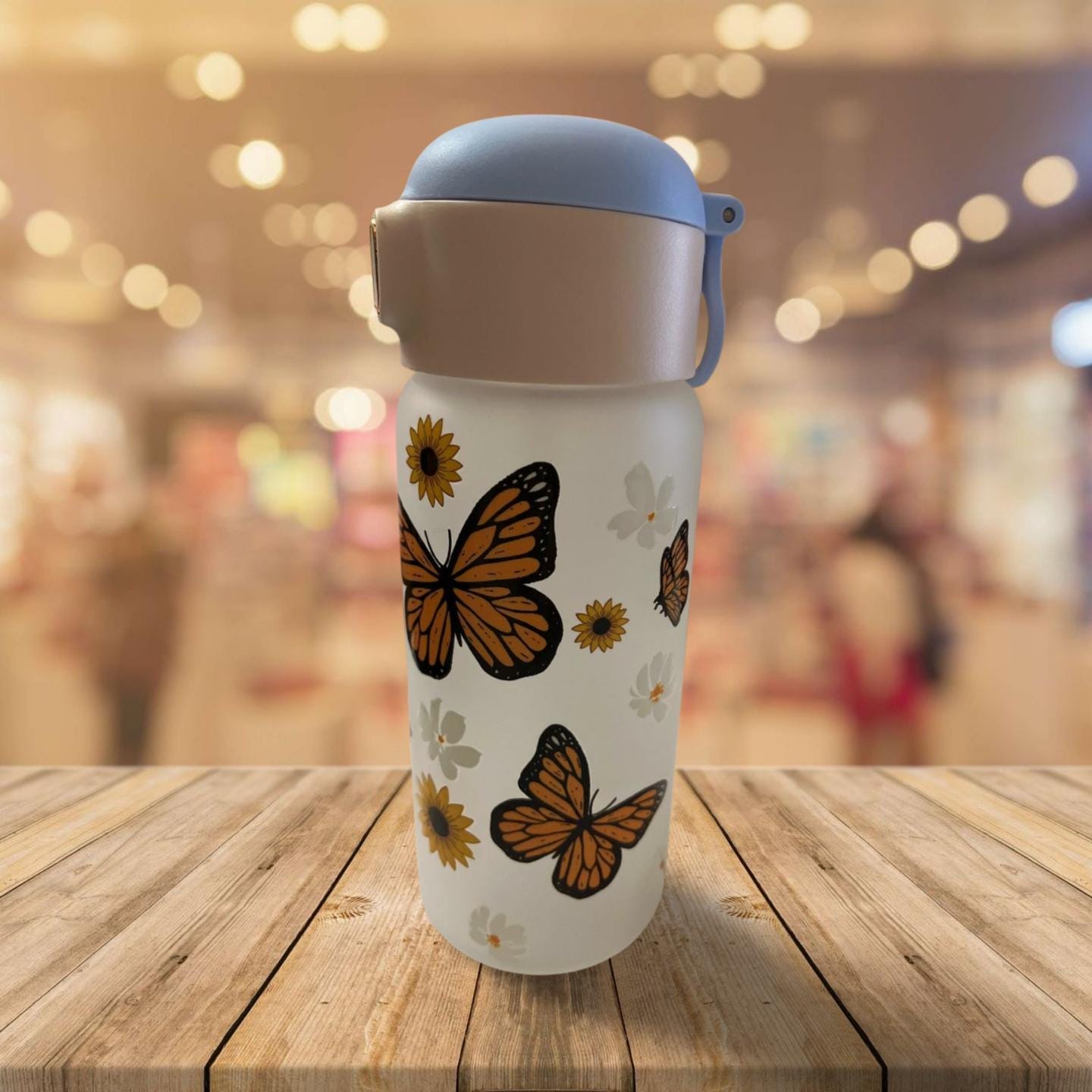 15 oz Frosted Glass Water Bottle with Blue Lid- Flowers and butterflies